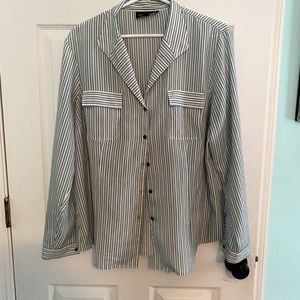 Synthetic button down long sleeve blouse.